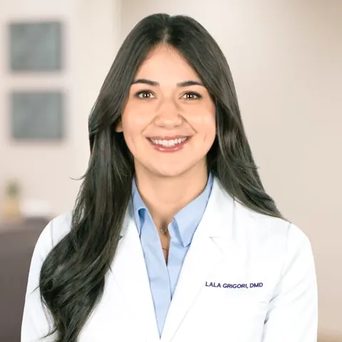 Portrait of Dr. Lala Grigori, DMD, in a white coat